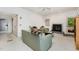Bright living room featuring a fireplace, plush seating, and a ceiling fan for added comfort at 6 Womble Cir, Durham, NC 27705