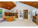 Spacious office with wood-paneled ceiling, built-in bookshelves, and a unique desk at 6 Womble Cir, Durham, NC 27705