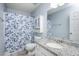 Bathroom with granite counter tops, a decorative shower curtain, and vanity mirror at 615 Southshore Pkwy, Durham, NC 27703