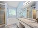 Bright bathroom features a large soaking tub, granite counters and a walk-in shower at 615 Southshore Pkwy, Durham, NC 27703