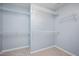 Walk-in closet featuring wire shelving and neutral carpet at 615 Southshore Pkwy, Durham, NC 27703