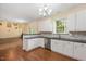 Well-lit kitchen featuring white cabinets, granite countertops and stainless steel appliances at 615 Southshore Pkwy, Durham, NC 27703