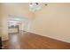 Living room with hardwood floors and an open floor plan to the kitchen and dining area at 615 Southshore Pkwy, Durham, NC 27703