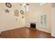 Spacious living room features hardwood floors, fireplace, and large windows with plantation shutters at 615 Southshore Pkwy, Durham, NC 27703