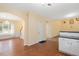 Open-concept living room with hardwood floors, wainscotting and bright natural light at 615 Southshore Pkwy, Durham, NC 27703