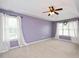 Spacious bedroom with trey ceiling, ceiling fan, carpet and natural light at 615 Southshore Pkwy, Durham, NC 27703