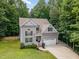 Beautiful aerial view of a well-maintained home with lush greenery and a spacious yard at 6717 Country Hollows Ln, Holly Springs, NC 27540