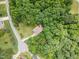 Secluded home nestled in lush greenery, offering privacy and a natural setting in a desirable location at 6717 Country Hollows Ln, Holly Springs, NC 27540