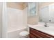 Full bathroom features a shower/tub combo and single sink vanity with storage at 6717 Country Hollows Ln, Holly Springs, NC 27540