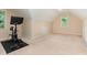 Carpeted bonus room with natural light, and exercise bike with weights at 6717 Country Hollows Ln, Holly Springs, NC 27540