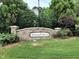 Stone community sign for Vintage Pointe neighborhood surrounded by manicured landscaping at 6717 Country Hollows Ln, Holly Springs, NC 27540