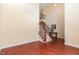 Open foyer area featuring hardwood floors, staircase, and elegant decor at 6717 Country Hollows Ln, Holly Springs, NC 27540
