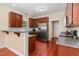 Well-equipped kitchen featuring stainless steel appliances, granite countertops, and custom cabinetry at 6717 Country Hollows Ln, Holly Springs, NC 27540