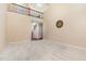 Bright, open living room with carpet, high ceiling and staircase with wood and metal details at 6717 Country Hollows Ln, Holly Springs, NC 27540