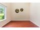 Home office space showcasing hardwood floors, natural light, and neutral wall color at 6717 Country Hollows Ln, Holly Springs, NC 27540