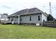 Expansive backyard with well-kept lawn and partial view of deck, bordered by tall privacy fence at 70 Dexterfield Dr, Fuquay Varina, NC 27526