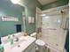 Bathroom featuring tiled shower with seating, modern vanity, and soothing green walls at 70 Dexterfield Dr, Fuquay Varina, NC 27526