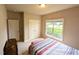 Bright bedroom with natural light, spacious closet, and plush carpeting for a comfortable space at 70 Dexterfield Dr, Fuquay Varina, NC 27526