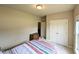 Inviting bedroom boasts closet space, neutral walls, and carpet, creating a calm sanctuary at 70 Dexterfield Dr, Fuquay Varina, NC 27526