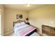 Cozy bedroom featuring neutral walls, comfortable bed, and a quaint dresser for a relaxing retreat at 70 Dexterfield Dr, Fuquay Varina, NC 27526