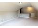 Spacious bonus room featuring carpet flooring, neutral paint, and ample lighting for a cozy atmosphere at 70 Dexterfield Dr, Fuquay Varina, NC 27526