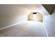 Spacious bonus room with plush carpet, ample natural light, perfect for entertainment or relaxation at 70 Dexterfield Dr, Fuquay Varina, NC 27526