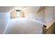 Neutral bonus room with carpet, dormer window and access to attic/storage at 70 Dexterfield Dr, Fuquay Varina, NC 27526