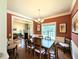 Formal dining room featuring hardwood floors, a large window, and decorative chandelier at 70 Dexterfield Dr, Fuquay Varina, NC 27526