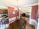 A dining room showing hardwood floors, and access to the kitchen and living room at 70 Dexterfield Dr, Fuquay Varina, NC 27526