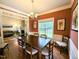 A dining room showing hardwood floors, and access to the living room at 70 Dexterfield Dr, Fuquay Varina, NC 27526