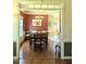 View of a dining room featuring hardwood floors, and access to the kitchen and living room at 70 Dexterfield Dr, Fuquay Varina, NC 27526