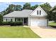 Charming single-story home featuring a two-car garage and well-maintained landscaping in a suburban setting at 70 Dexterfield Dr, Fuquay Varina, NC 27526