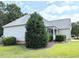 Well-maintained home featuring a manicured lawn, established landscaping, and charming curb appeal at 70 Dexterfield Dr, Fuquay Varina, NC 27526