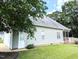 Exterior view of home with attached garage, white door and gray siding with landscaped yard at 70 Dexterfield Dr, Fuquay Varina, NC 27526
