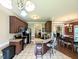Open kitchen with island and eat in dining space featuring stainless appliances and bar seating at 70 Dexterfield Dr, Fuquay Varina, NC 27526