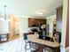 Kitchen with island and bar seating offering stainless appliances and access to dining space at 70 Dexterfield Dr, Fuquay Varina, NC 27526