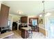 Open concept kitchen with stainless appliances island overlooking living and dining area at 70 Dexterfield Dr, Fuquay Varina, NC 27526