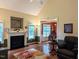 Inviting living room features hardwood floors, a fireplace, and bright windows at 70 Dexterfield Dr, Fuquay Varina, NC 27526