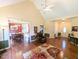 Bright and airy living room with hardwood floors, connecting to dining area and front entryway at 70 Dexterfield Dr, Fuquay Varina, NC 27526