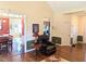 Open-concept living room with hardwood floors, seamlessly connecting to the kitchen and dining areas at 70 Dexterfield Dr, Fuquay Varina, NC 27526