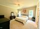 Spacious main bedroom with neutral carpet, ceiling fan, and natural light at 70 Dexterfield Dr, Fuquay Varina, NC 27526