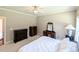 Large main bedroom with neutral carpet, furniture set, and ample natural light at 70 Dexterfield Dr, Fuquay Varina, NC 27526