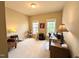 Versatile office space featuring ample natural light, neutral carpet, and comfortable furniture at 70 Dexterfield Dr, Fuquay Varina, NC 27526