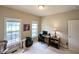 Bright office space featuring windows, a computer, and a cat tree at 70 Dexterfield Dr, Fuquay Varina, NC 27526