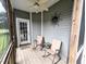 Inviting screened porch with ceiling fan, rocking chairs, and a view of the outdoors at 70 Dexterfield Dr, Fuquay Varina, NC 27526