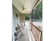Cozy screened-in porch with rocking chairs offers a relaxing view of the backyard and lush greenery at 70 Dexterfield Dr, Fuquay Varina, NC 27526