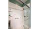 Close up of modern tiled shower with seating, safety bars, and convenient shelving at 70 Dexterfield Dr, Fuquay Varina, NC 27526