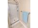 Modern shower with glass door, mounted shower head, and convenient shelving at 70 Dexterfield Dr, Fuquay Varina, NC 27526