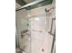 Close up of modern tiled shower with seating, safety bars, and convenient shelving at 70 Dexterfield Dr, Fuquay Varina, NC 27526