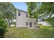 Backyard featuring grass, patio, and mature trees at 702 Calavaras Ln, Knightdale, NC 27545